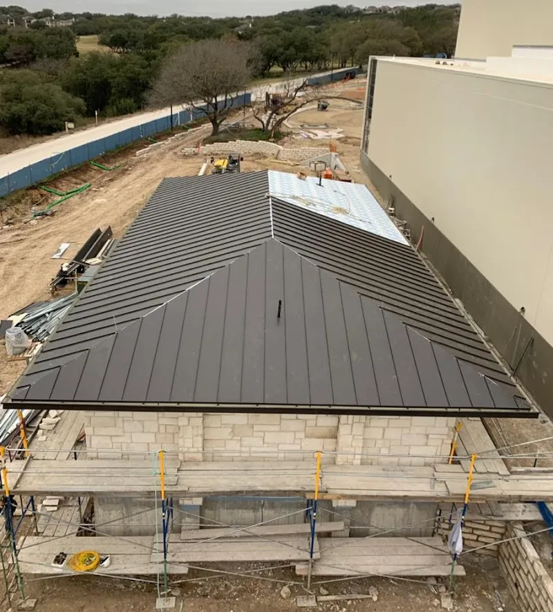 Metal roof new construction with scaffolding in Erwin